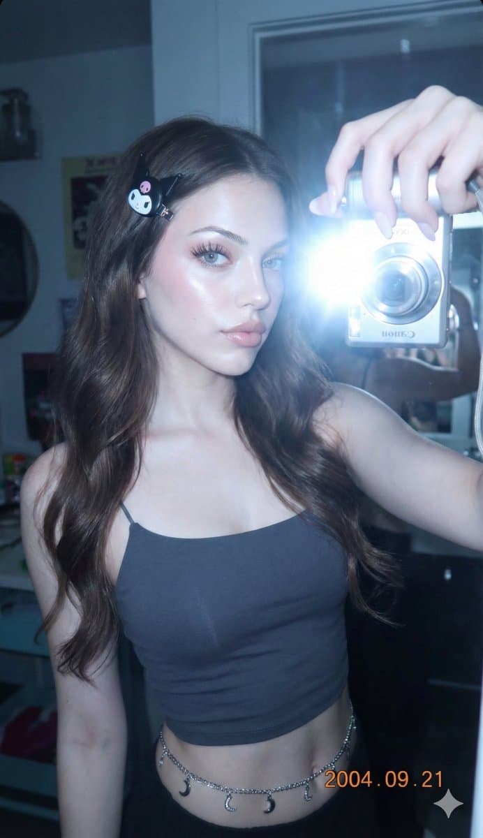 Stylish Mirror Selfie: Young Woman in Crop Top & Kuromi - Portrait Photography AI prompt