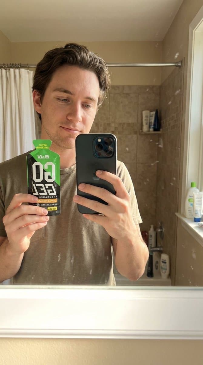 Man with Energy Gel: Photorealistic Product Selfie - Product Photography AI prompt