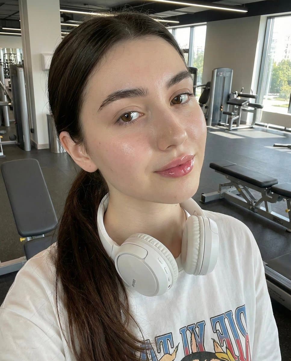 Young Woman in Gym Selfie with Headphones - Fitness Portrait - Portrait Photography AI prompt