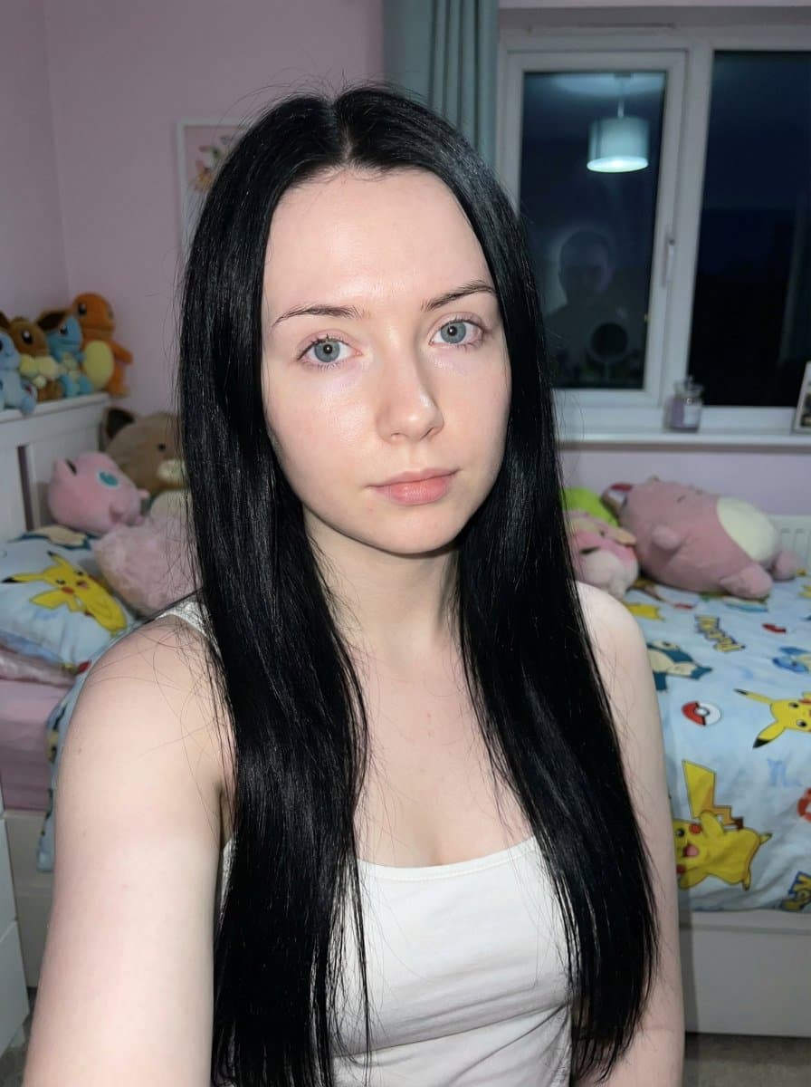 Photorealistic Portrait: Young Woman, Black Hair, Blue Eyes - Portrait Photography AI prompt