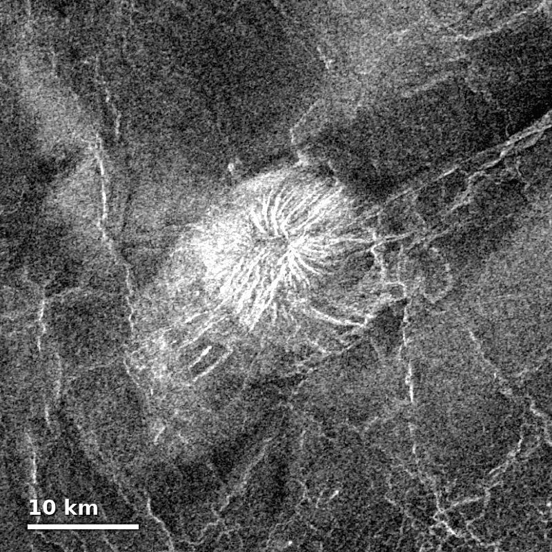 Radar image from NASA's Magellan mission showing a bright volcanic cone with radial lava flows